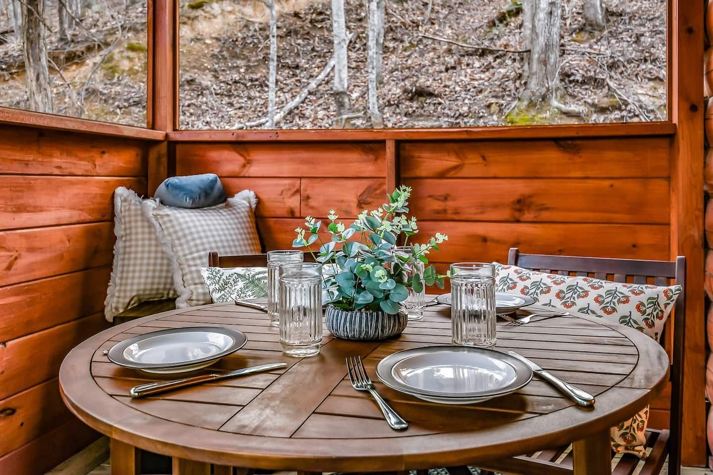 Enjoy meals on the screened back porch during any season. With woodland views all around, it’s a peaceful place to linger over breakfast, share dinner, or simply take in the calm of the forest.