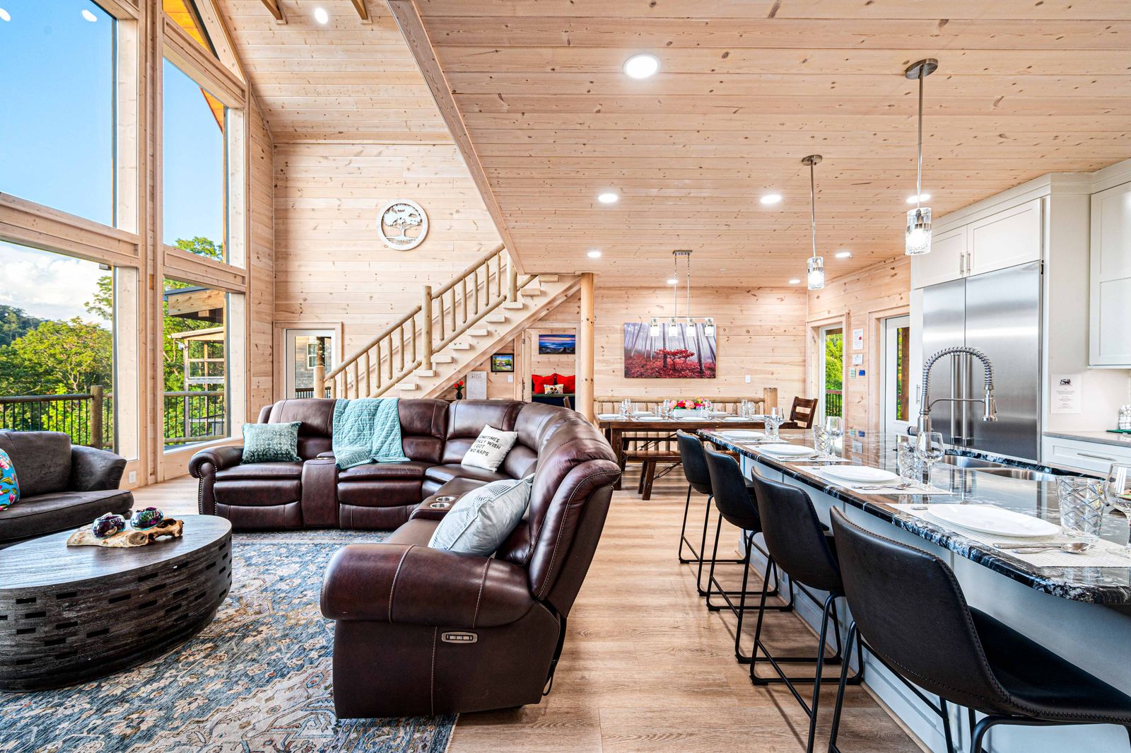 Leather sectional, kitchen island, and dining area