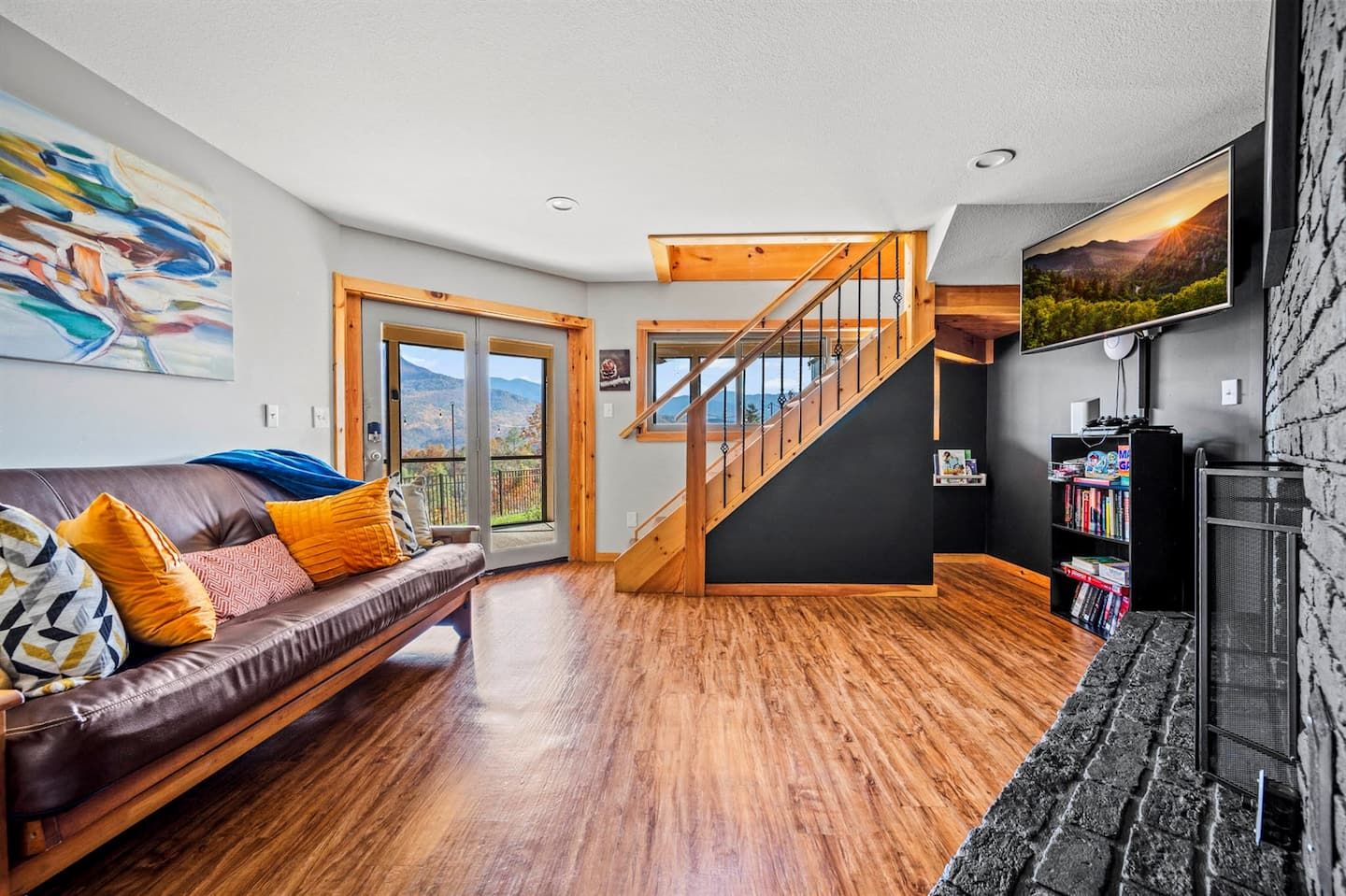 Challenge your loved ones to an evening of entertainment in our game room, complete with a gas fireplace, Smart TV, arcade, and a futon that unfolds into a cozy sleeper. Enjoy books and board games with the mountains as your stunning backdrop.