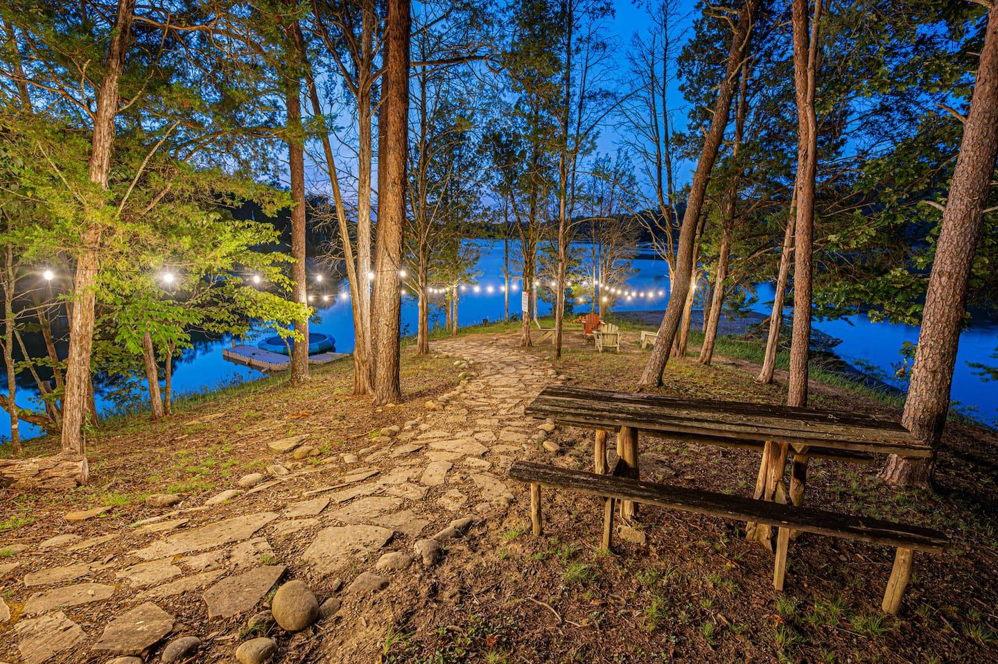 A picnic table down by the water, the fire pit going behind you, and the whole waterfront to spread out on.