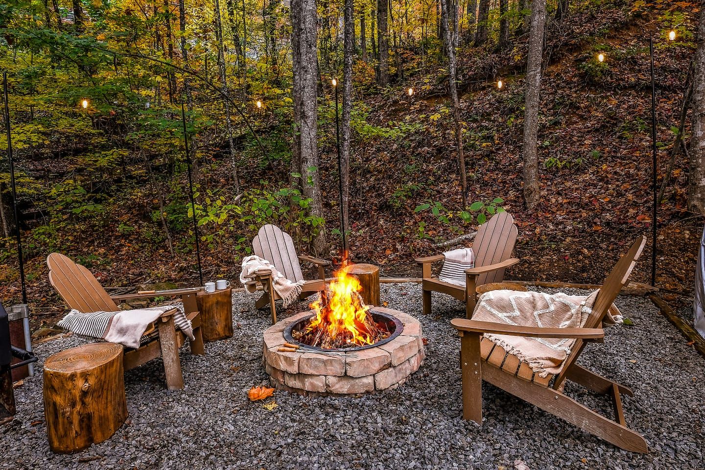Surrounded by the quiet of the woods, the firepit invites slow evenings beneath the open sky. Settle into a chair, wrap up in a blanket, and enjoy the warmth of the fire as conversation and laughter drift into the night.