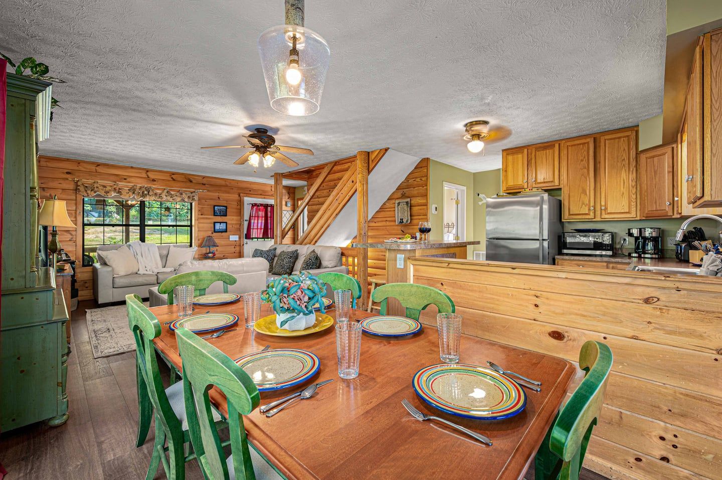 Open dining, living room, and kitchen flowing together on the main level, so nobody gets stuck cooking alone.