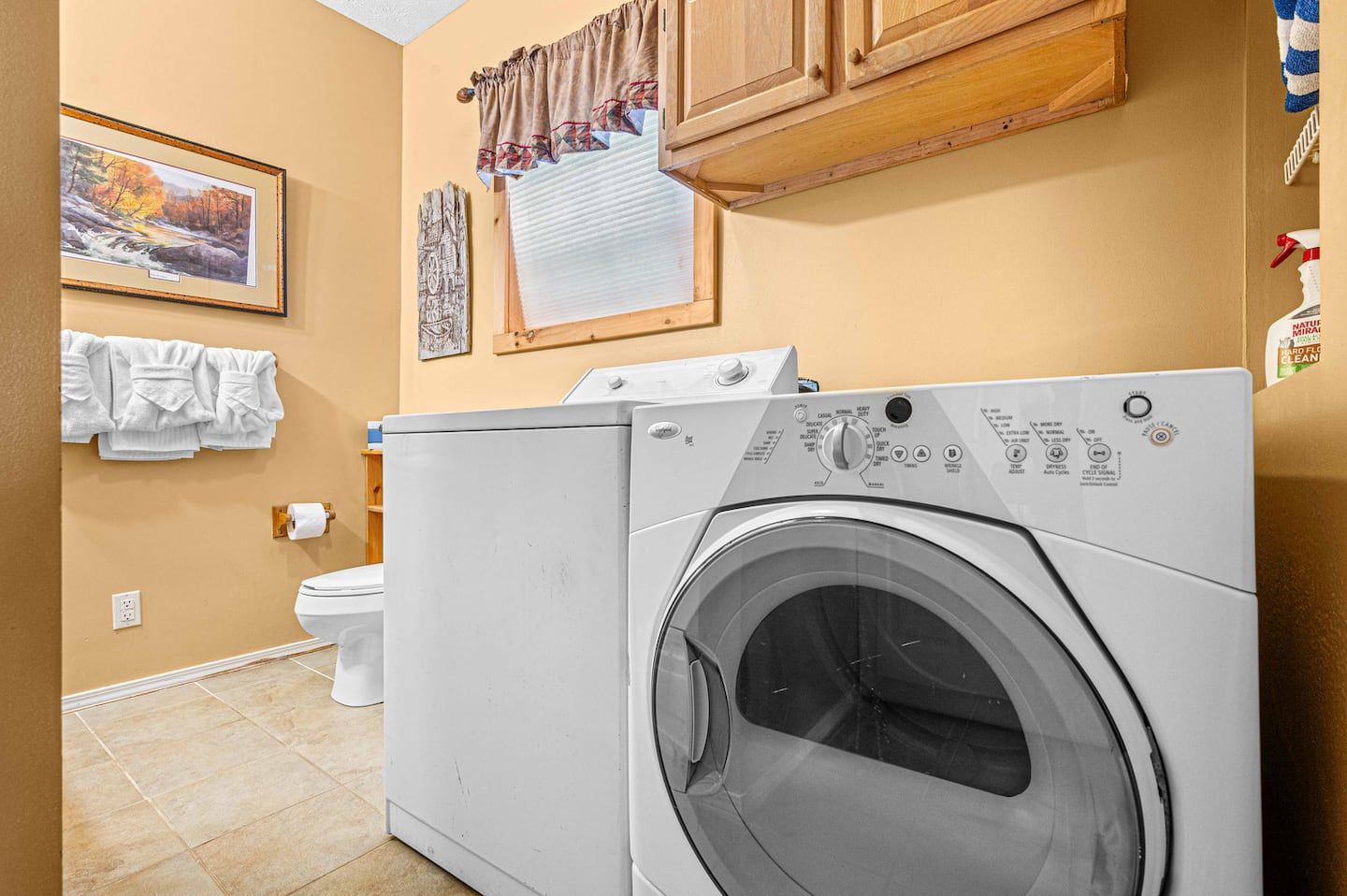 Washer and dryer on the basement level, sharing the full bathroom next to the game room.