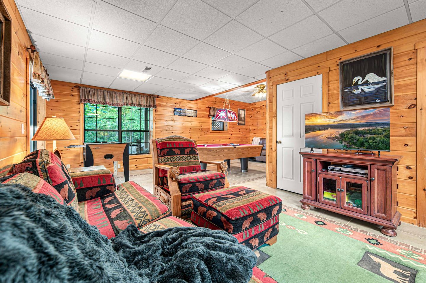 More seating and a TV in the game room, so the crowd can split up without splitting the cabin.