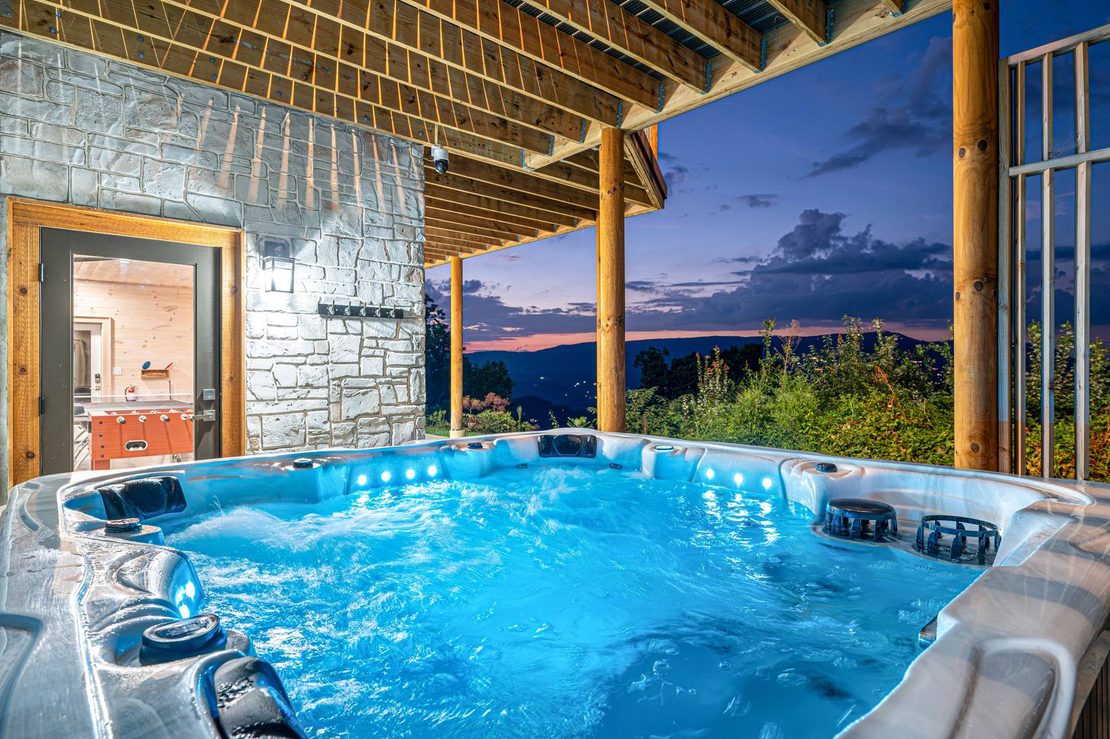 The hot tub on the covered patio at dusk