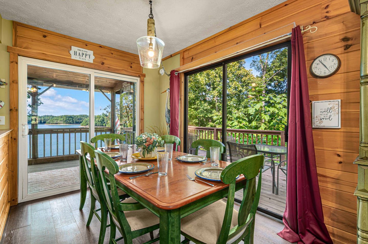 The dining table seats the whole crew with the sliding doors open to the lakefront deck. Pass the plates, leave the doors open, let the lake air in.