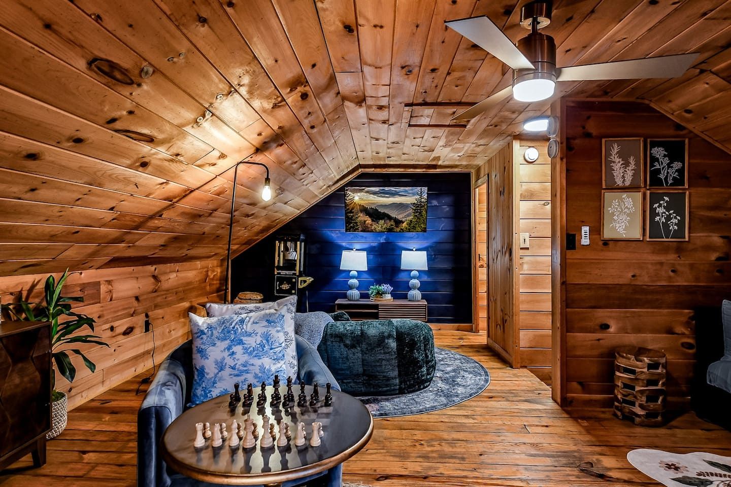 The loft offers a comfortable sitting area with a 50" Smart TV, providing a private retreat above the main level. Whether you’re unwinding on your own or gathering for movie night, this space adapts easily to the rhythm of your stay.