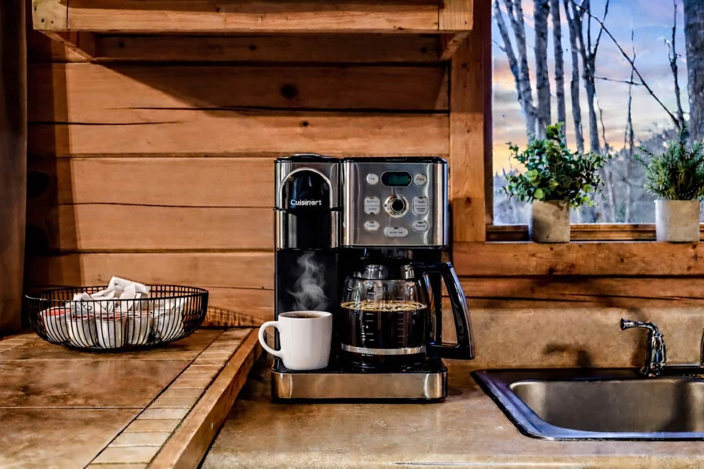Begin your mornings at the coffee station, with drip and pod options for coffee or tea — then carry your mug out to the porch to enjoy the stillness of the woods.