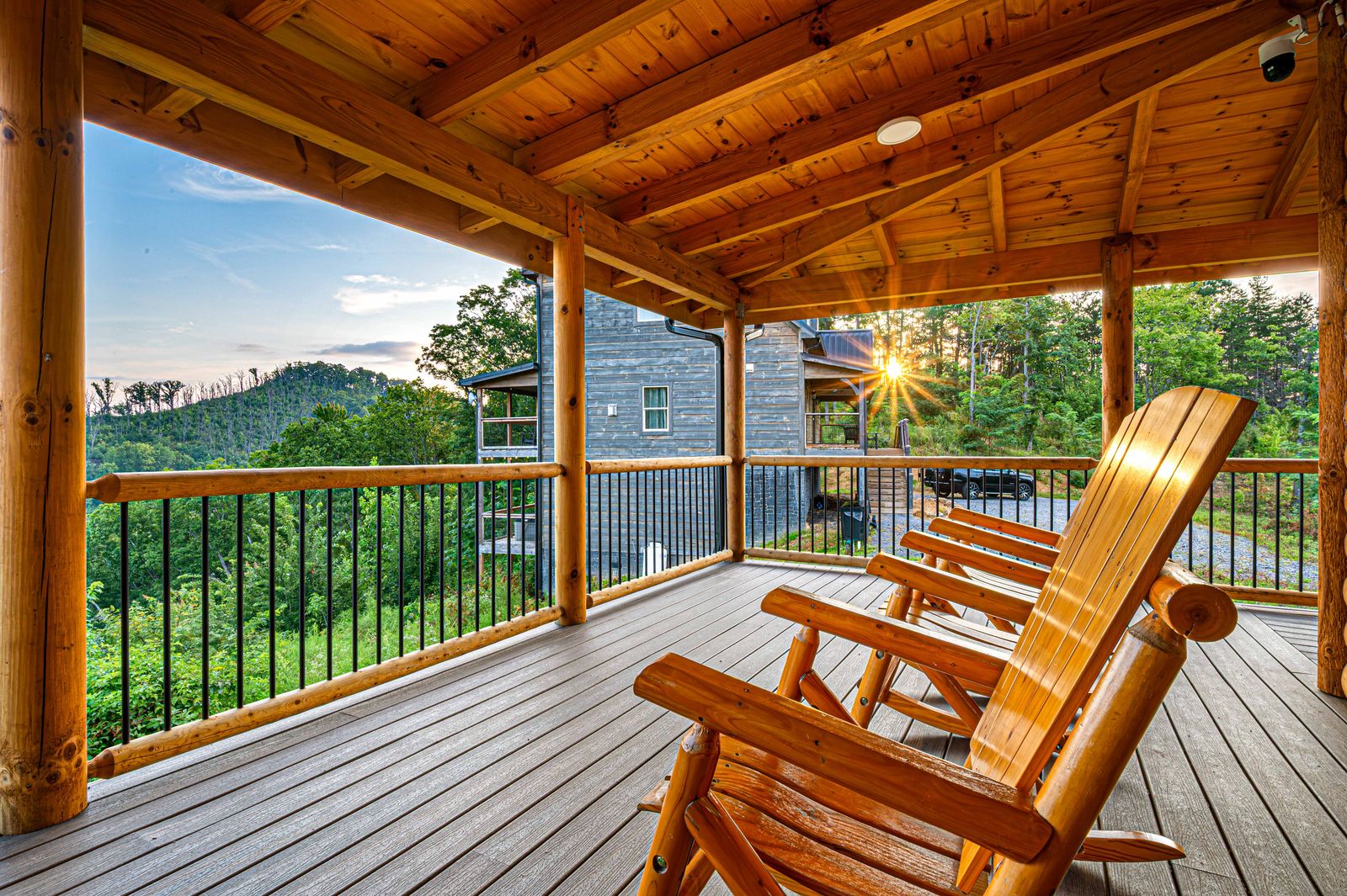 Rocking chairs on the main-level deck at sunset