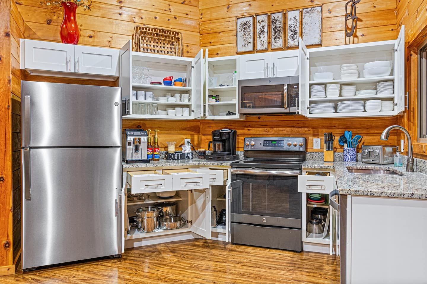 You'll know exactly what you're getting in our fully loaded kitchen. Take a peek into our cupboards to behold a comprehensive array of cookware and servingware.