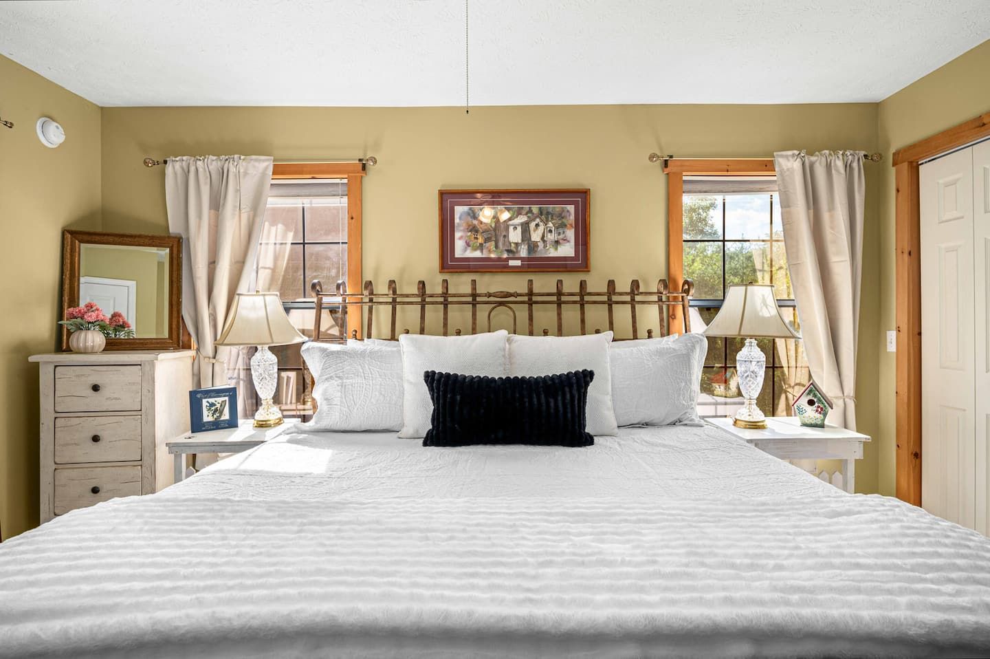 King bed in the main-level master bedroom, steps from the kitchen and the main-level full bathroom.