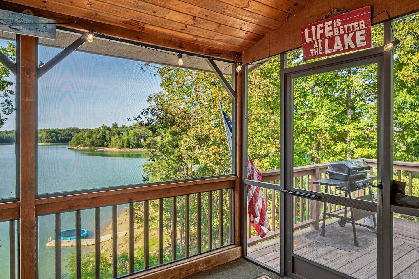 The screened porch has one of the biggest Douglas Lake views in the cabin. Breeze, no bugs, all day if you want it.