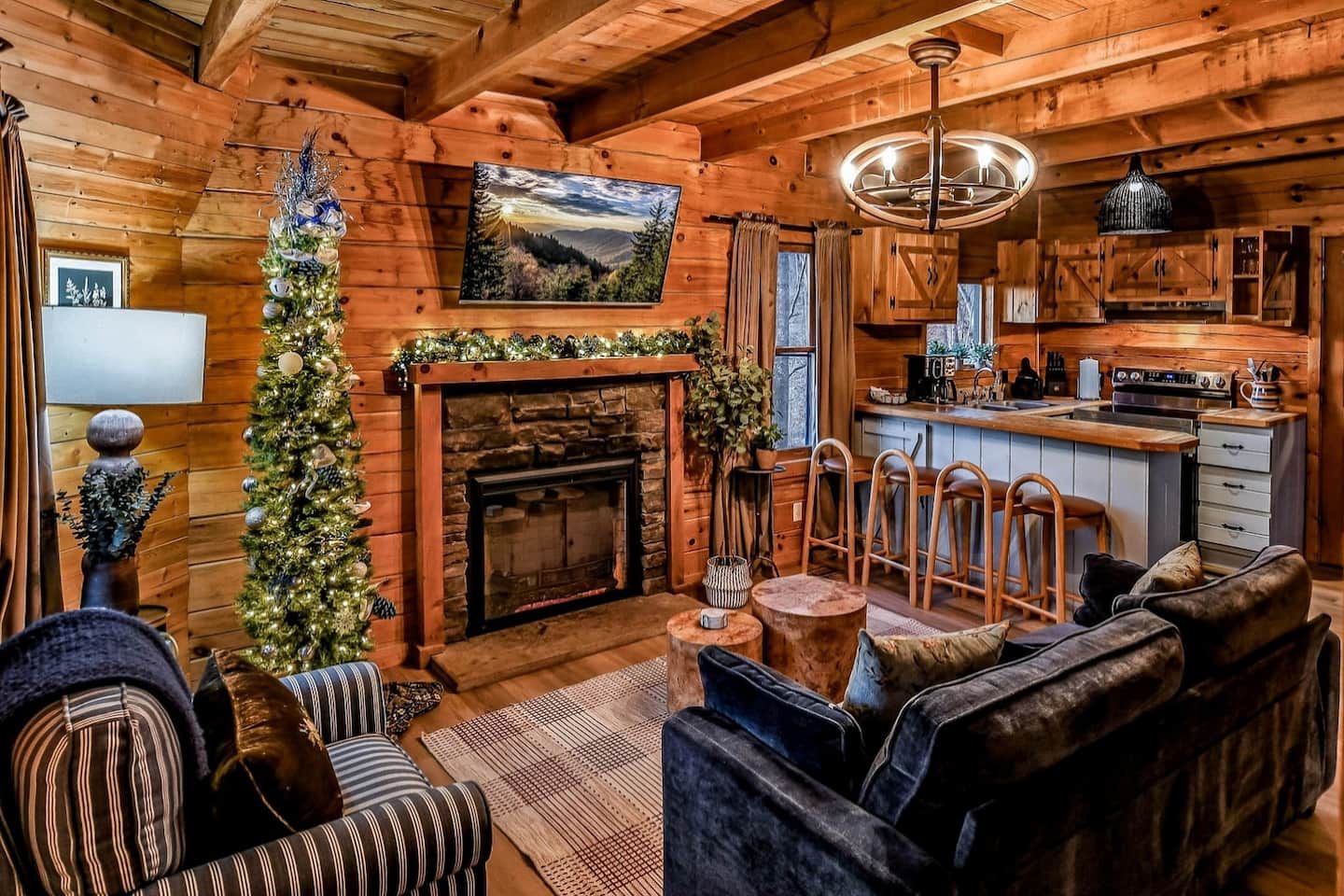Christmas at Bluebird's Perch feels like coming home — the tree glowing in its signature blue, garland draped across the mantel, and a soft spot on the sofa saved for cocoa and slow winter evenings together.