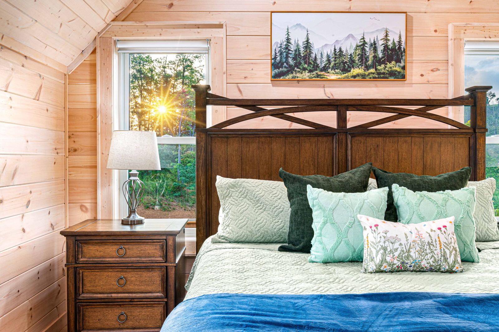 An upstairs king suite with the sun coming through the window