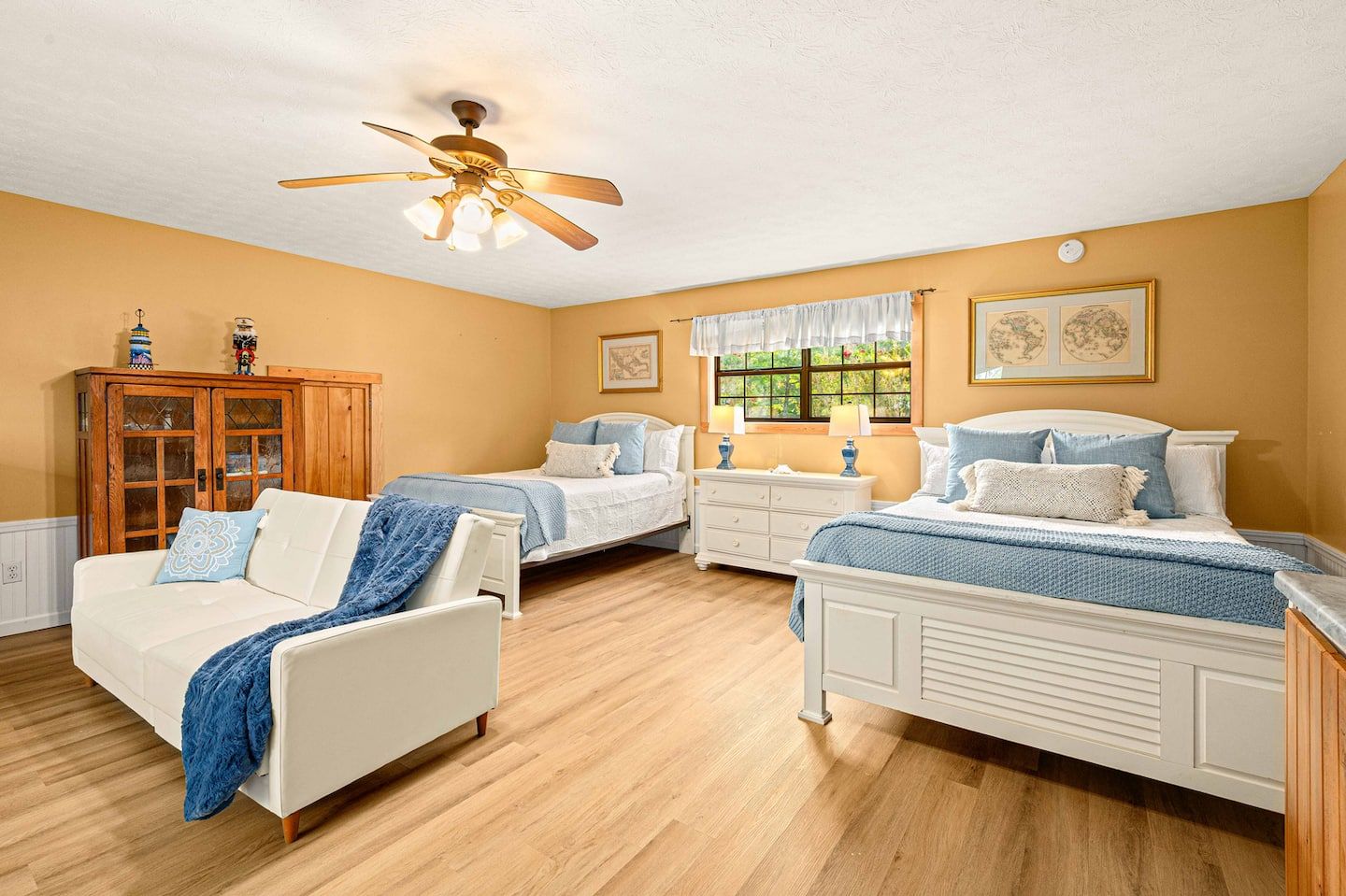 Two queen beds in the private apartment above the garage, separate from the main lakefront cabin.