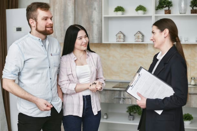 a-landlord-speaking-with-two-prospective-tenants a-landlord-speaking-with-two-prospective-tenants