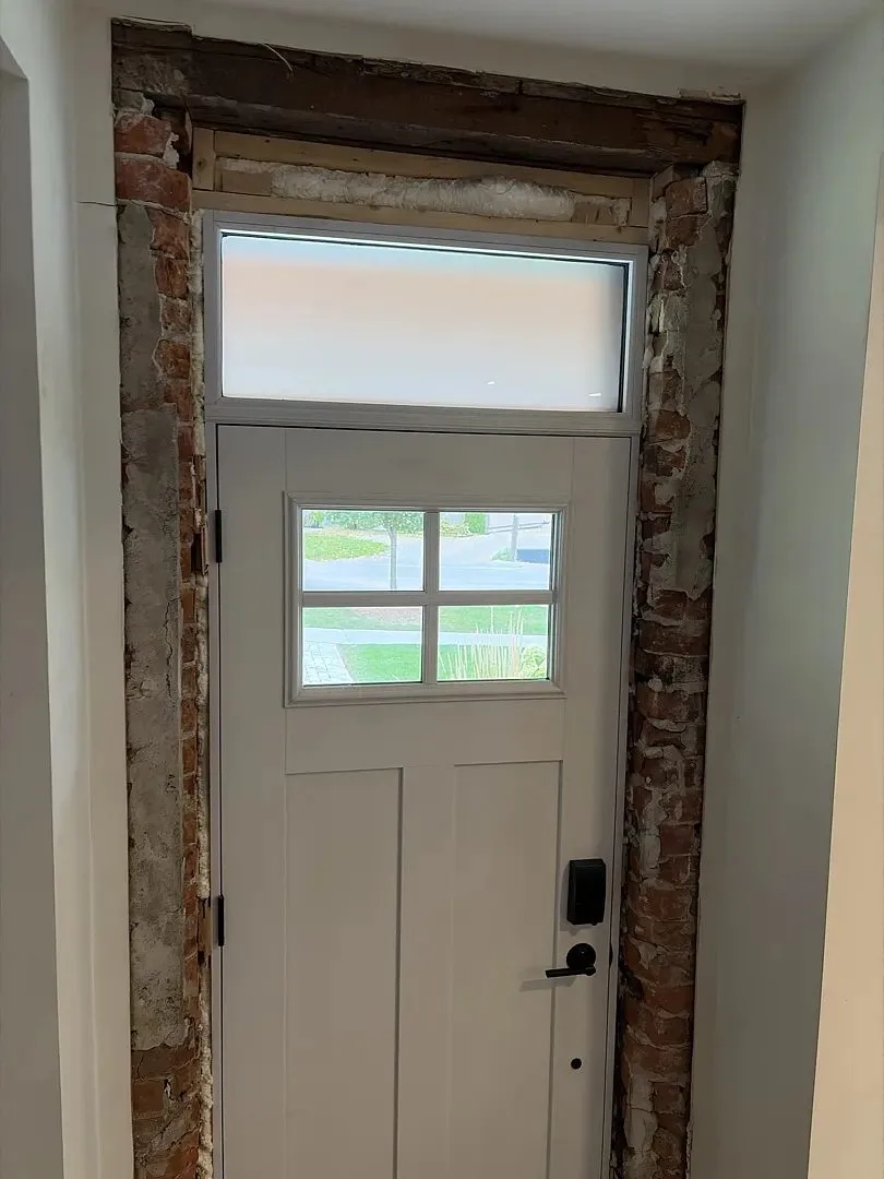 Old entry door removed and the opening prepared for the new unit