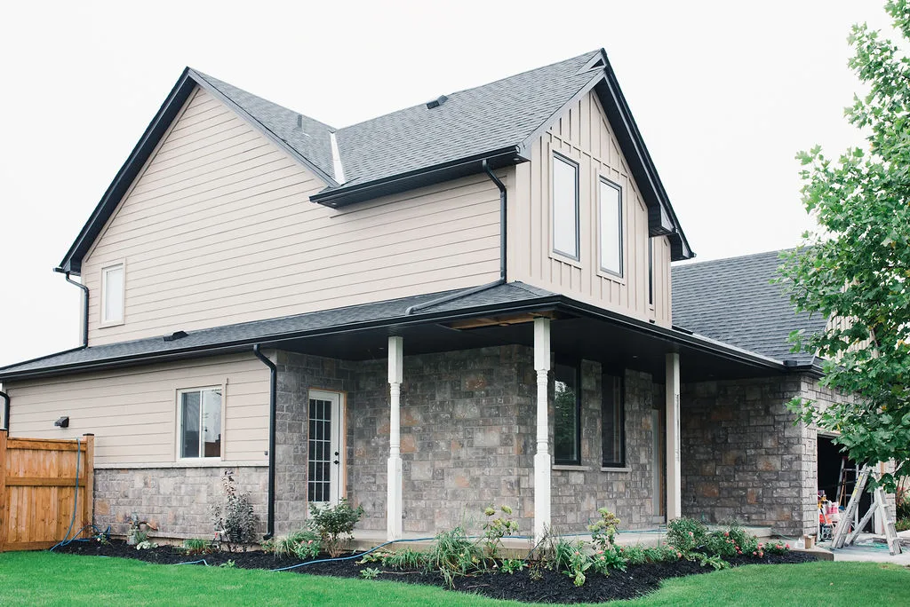 Stone and lap siding on a two-storey home