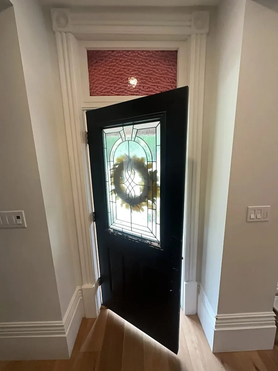 The new entry door with leaded glass seen from inside