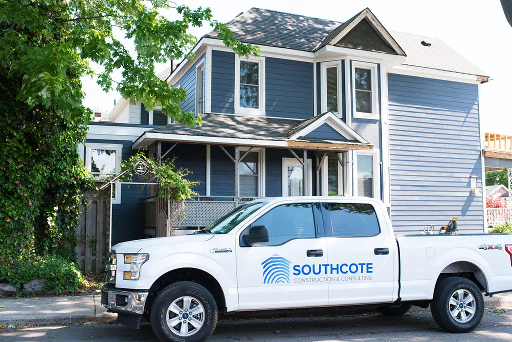 Southcote Construction truck parked outside a navy-sided home