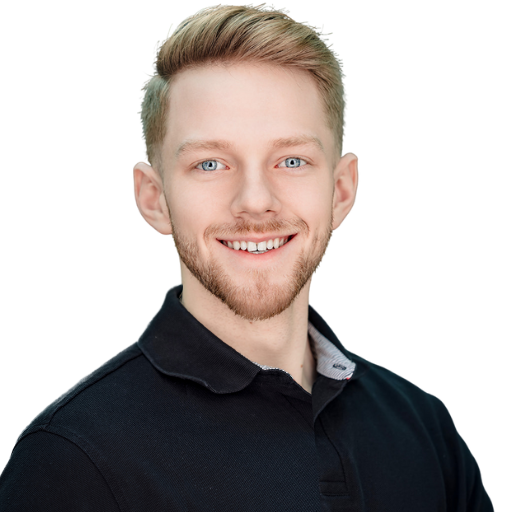 Lucas Neuman – Marketing expert helping auto detailers grow with paid ads and automation, smiling in a professional headshot with a dark forest background.