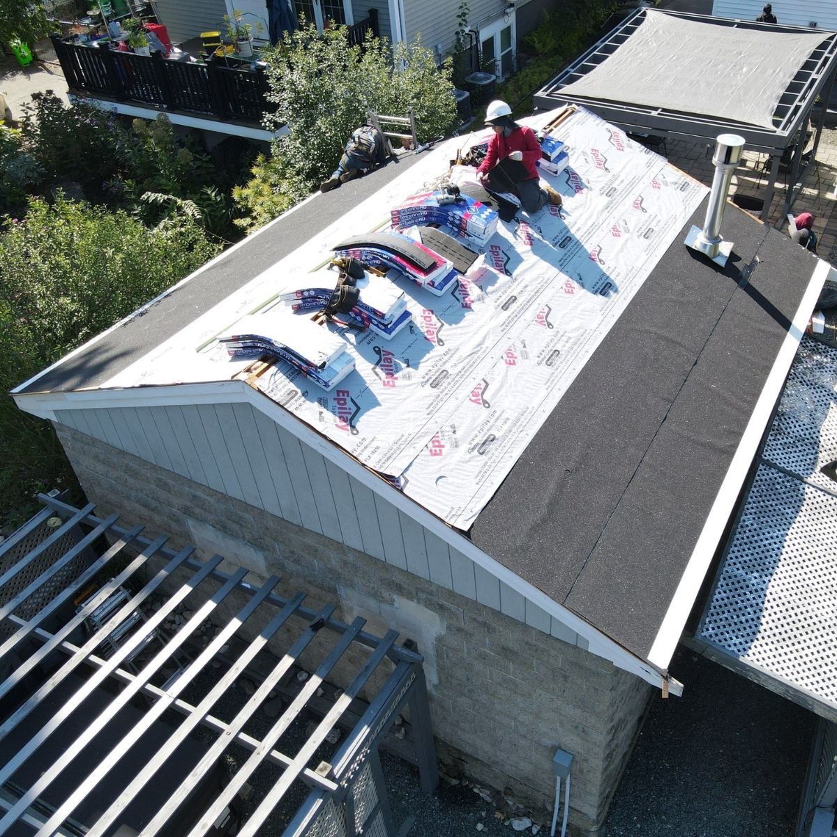 Roof replacement in progress with underlayment