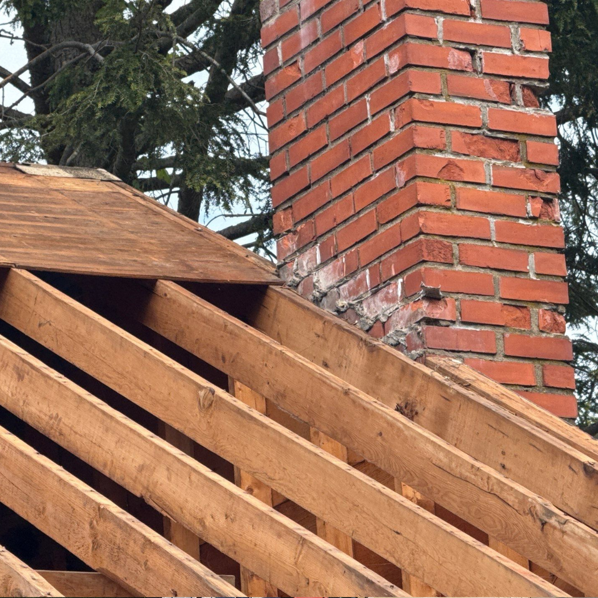 Roof repair and chimney flashing work on a home in Stoneham Massachusetts