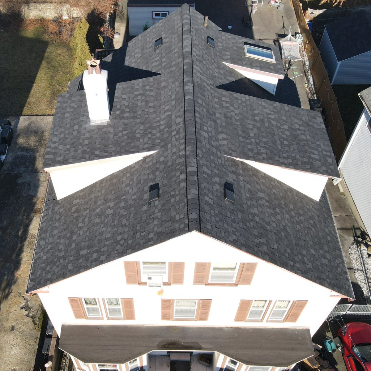 Completed asphalt shingle roof installation on a Winchester MA home