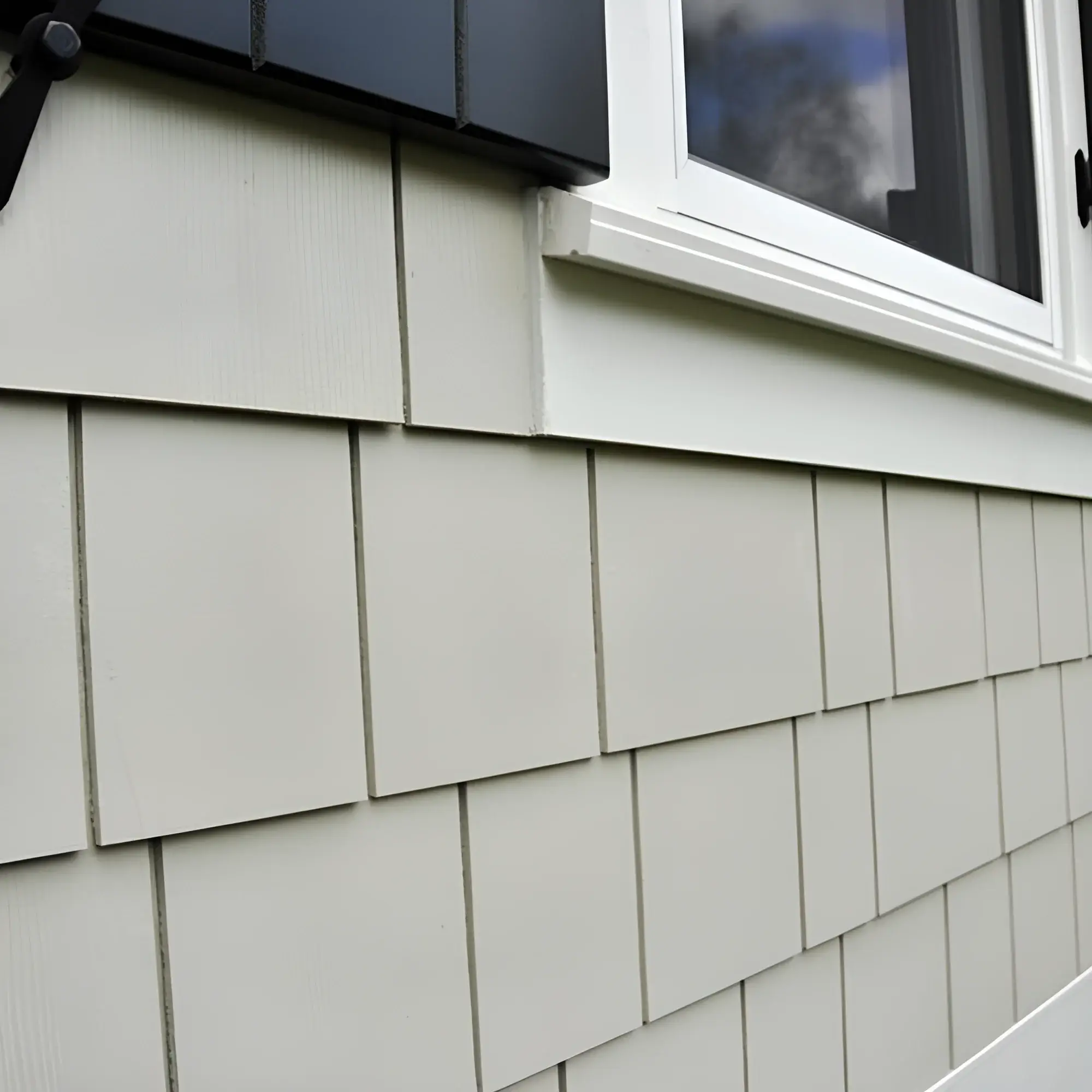 Hardie board siding installation on residential exterior