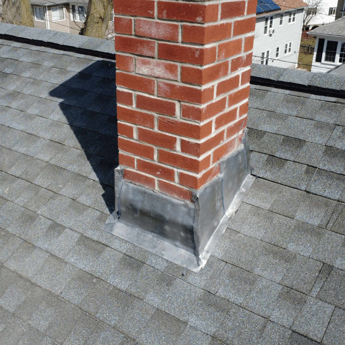Roof chimney flashing repair completed for leak prevention in Massachusetts