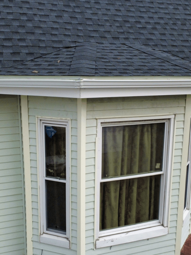 Roof replacement work in progress on historic brick home in Malden MA