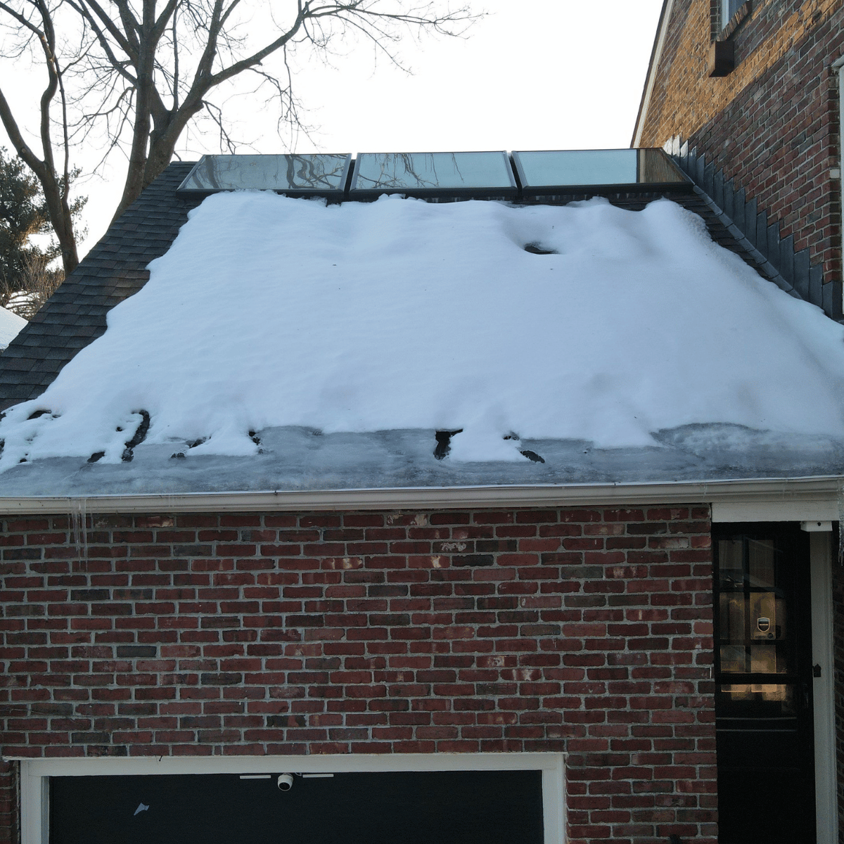 Snow buildup on a Massachusetts roof that may contribute to ice dams