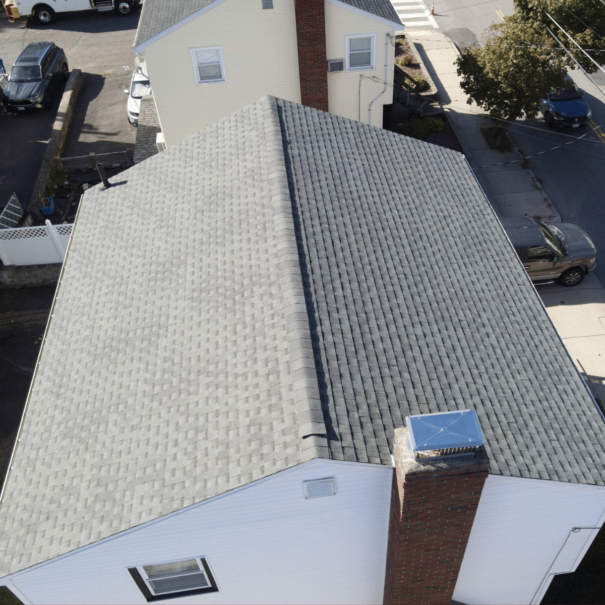 Roof replacement work in progress on historic brick home in Malden MA