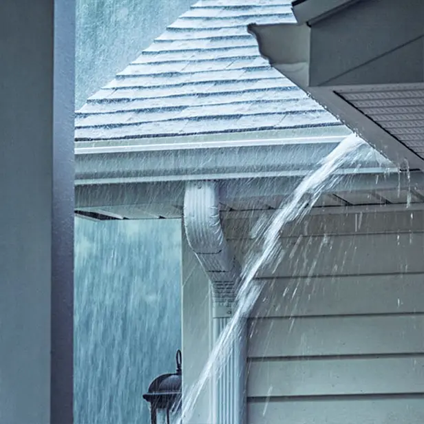 Overflowing gutters during heavy rain in Massachusetts home