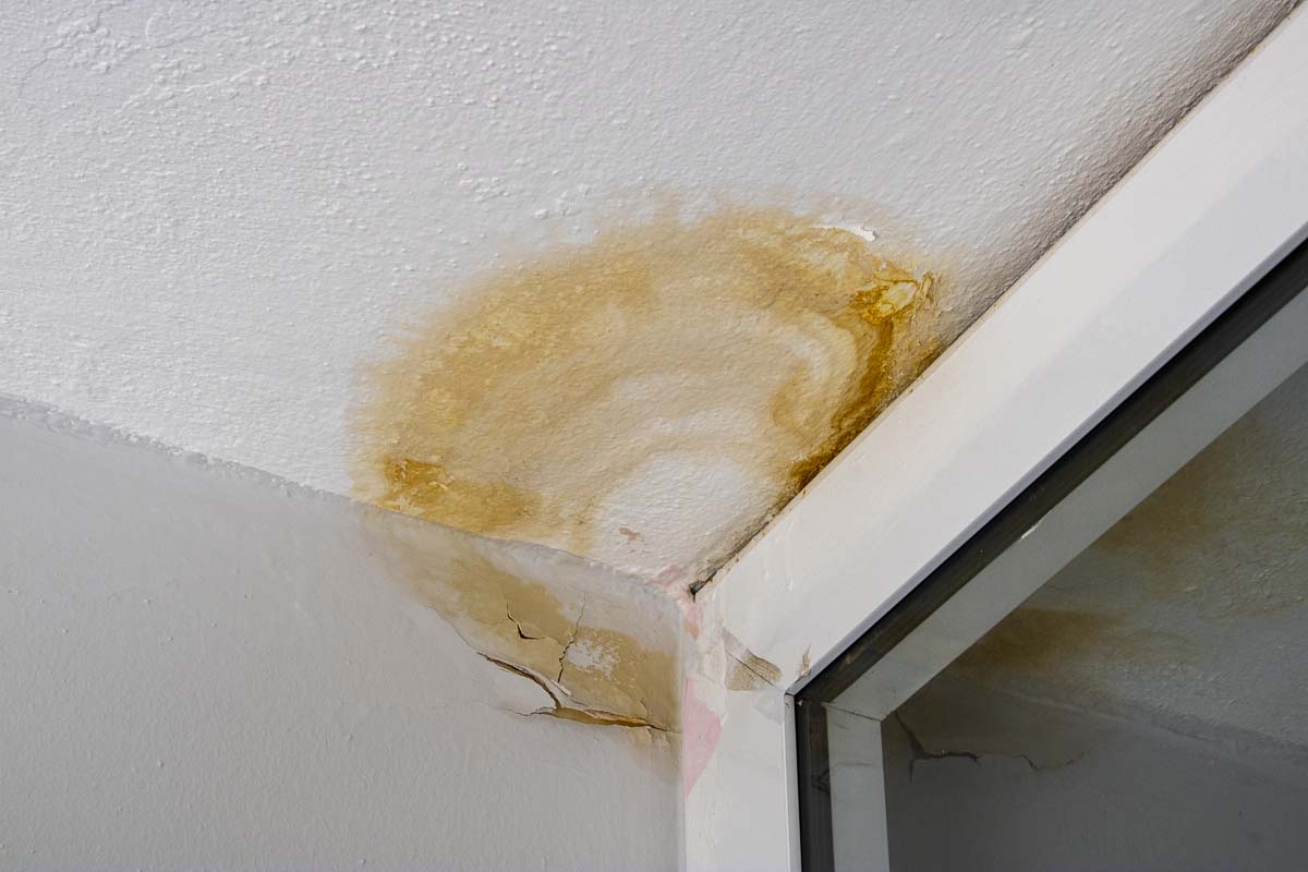 Ceiling water stain caused by a possible roof leak in a home