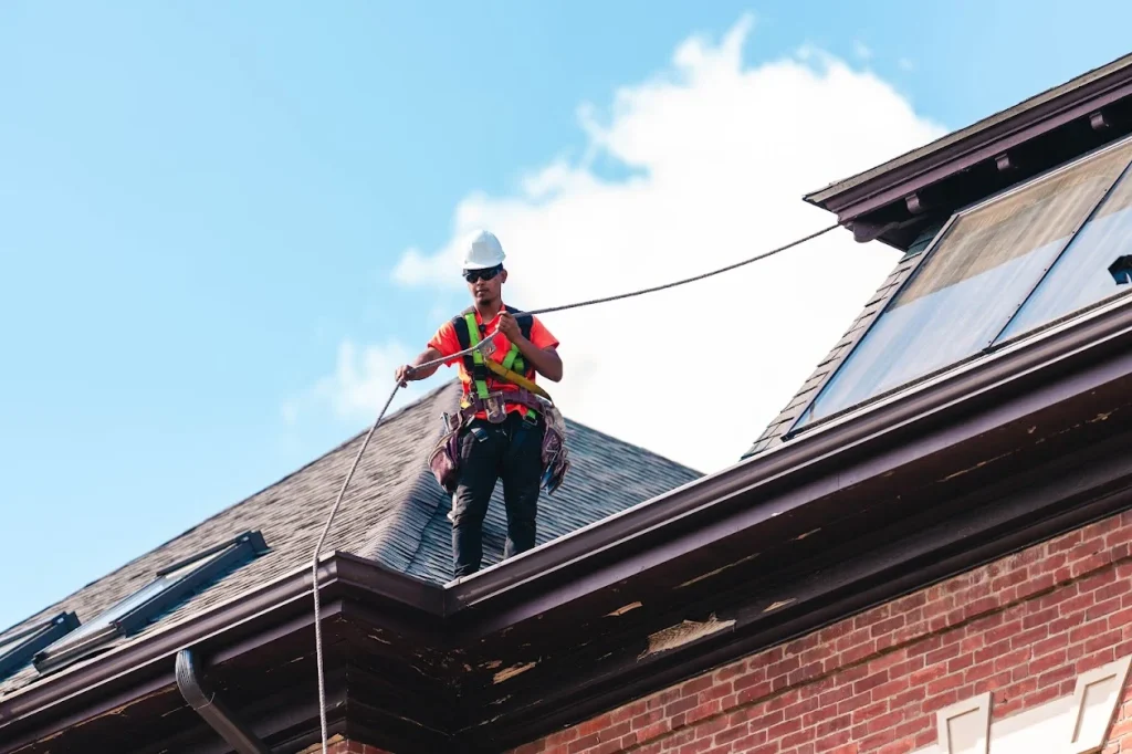 Roofing contractor performing a residential roof inspection