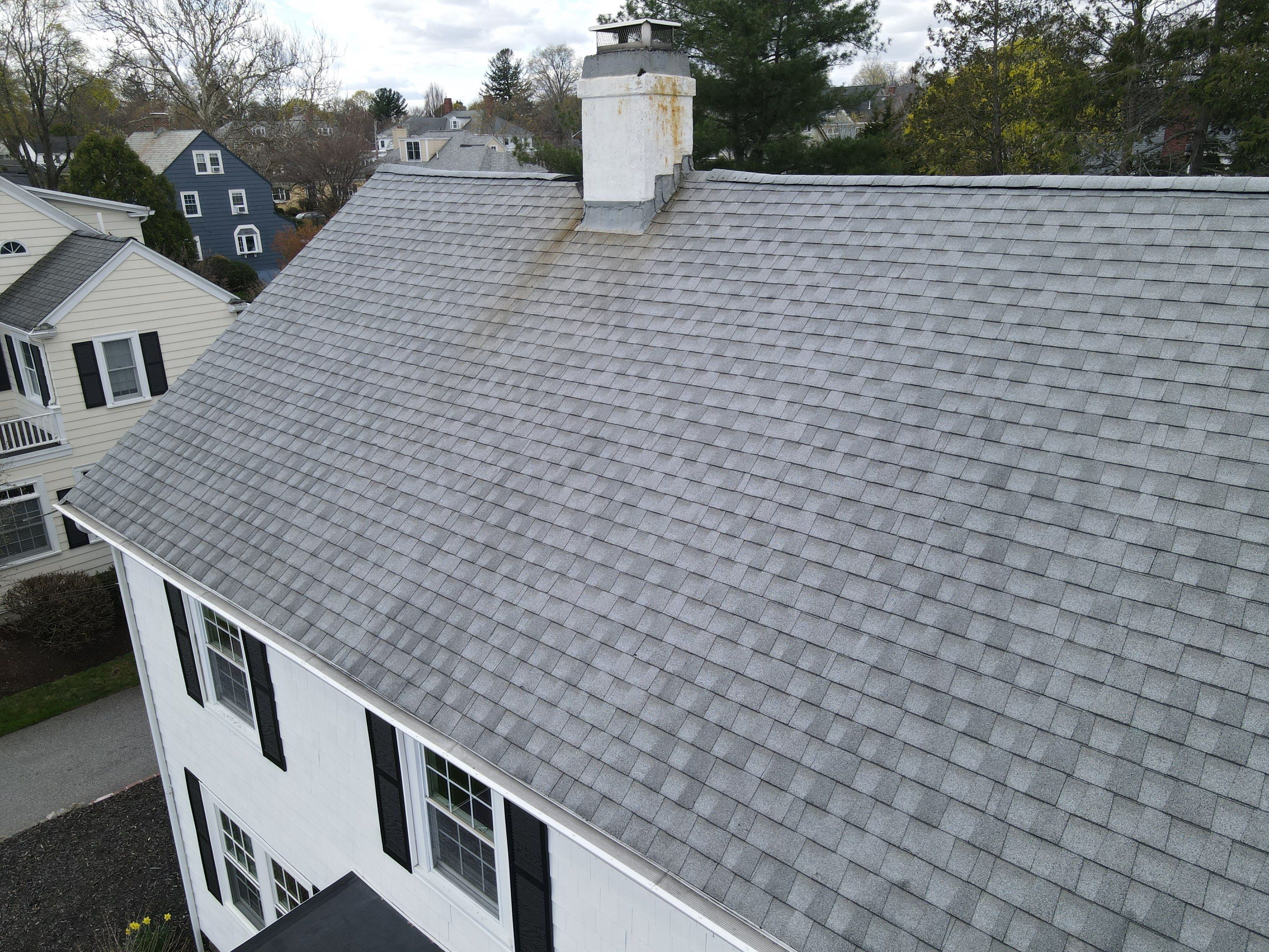 Asphalt shingle roof with skylights and roof vents for attic ventilation