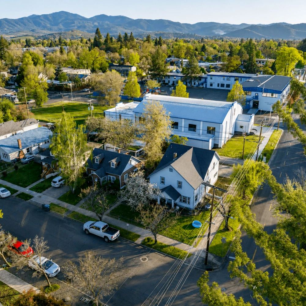 Aerial view of residential roof replacement and construction in a Medford MA neighborhood