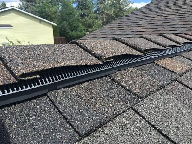 `Asphalt shingle roof with ridge vent installation on a home in Malden, MA`