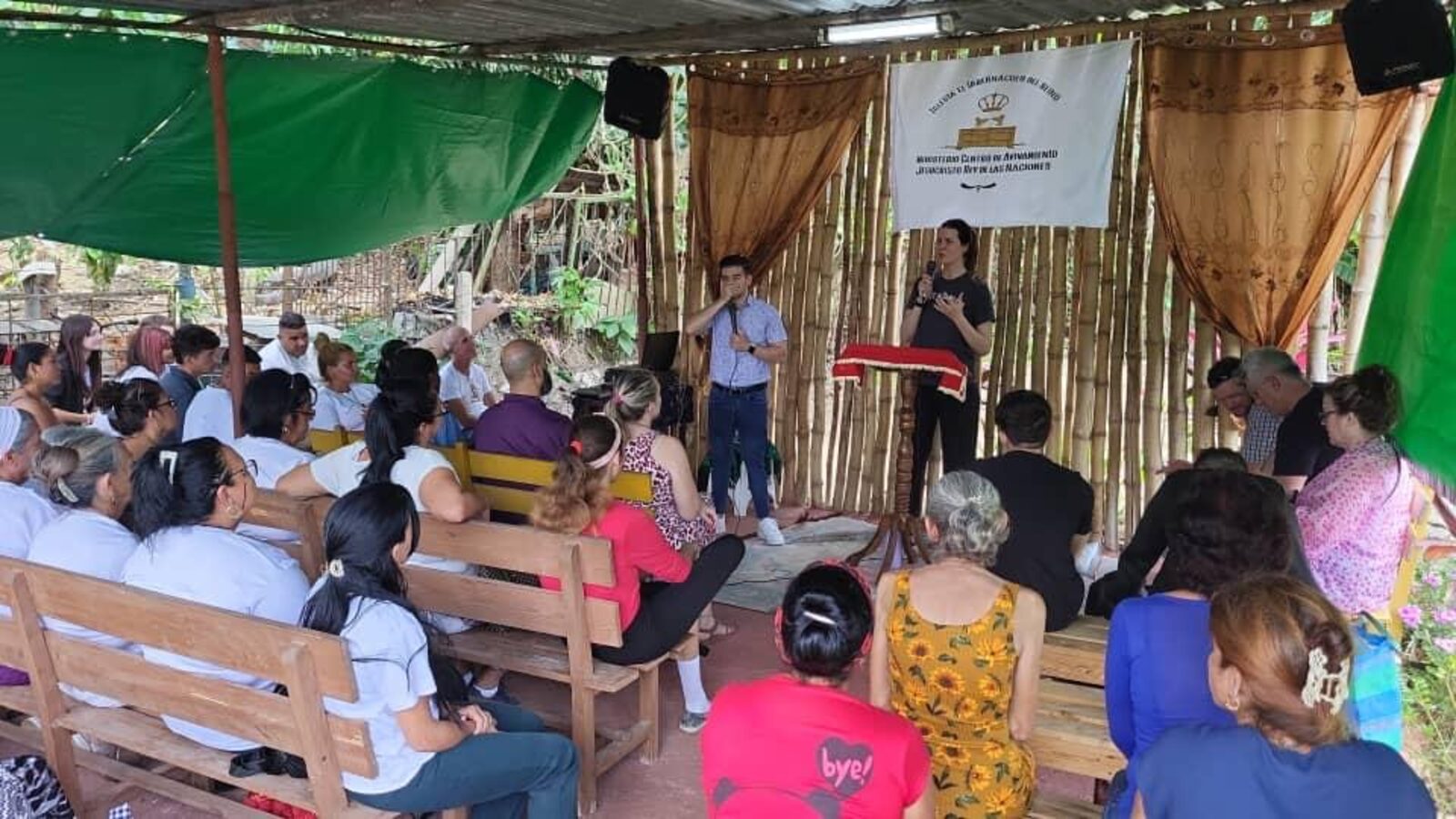 Rachel speaking to a congregation in Cuba