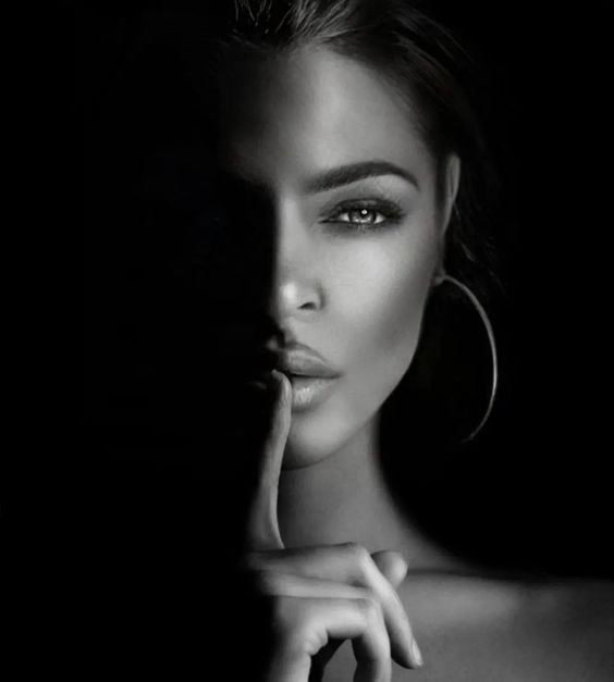 Black-and-white portrait representing privacy, discretion, and image control.