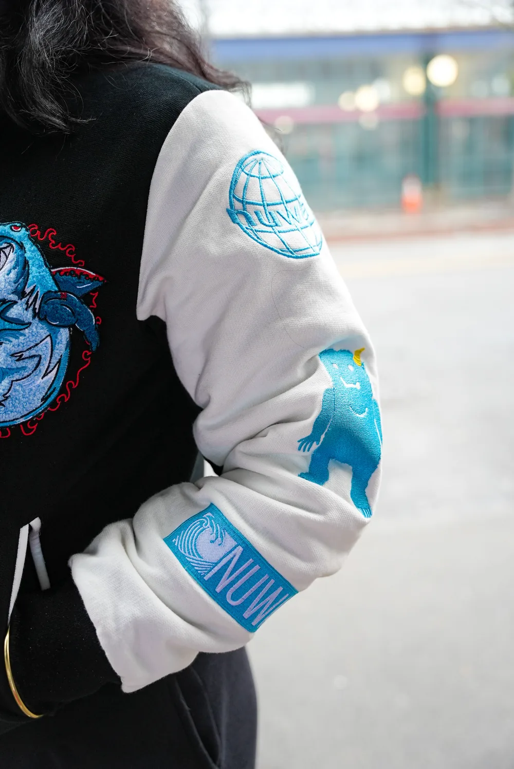 Sleeve detail with the globe, Yeti and NuWav patches