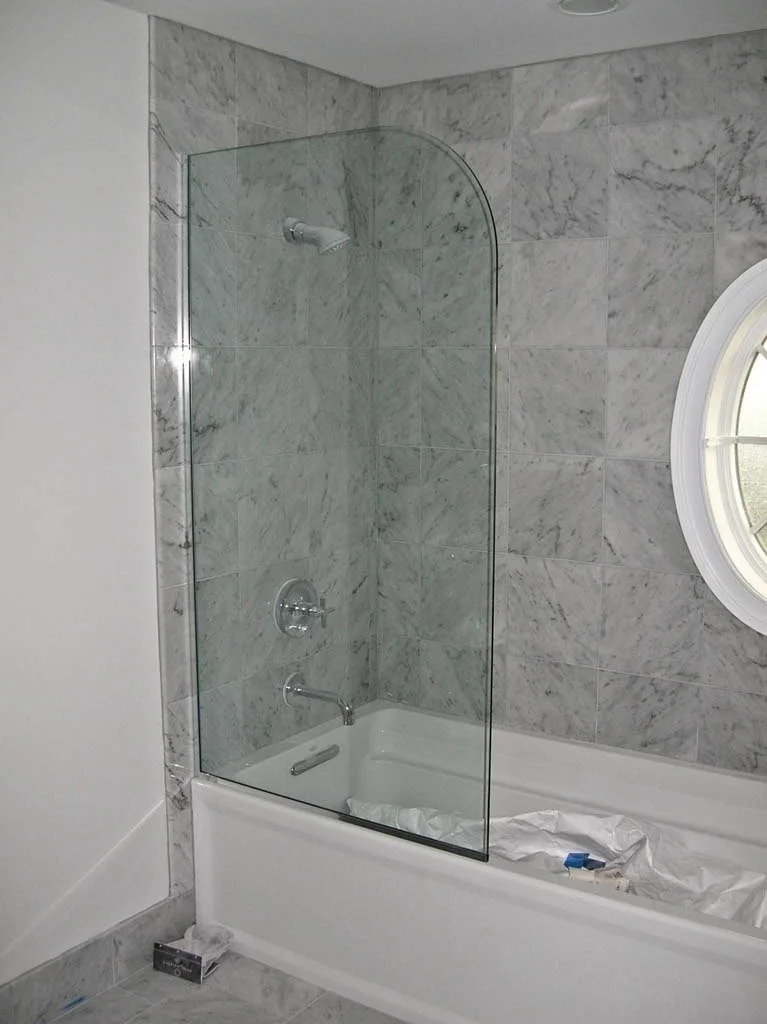 Roman style shower with curved panel