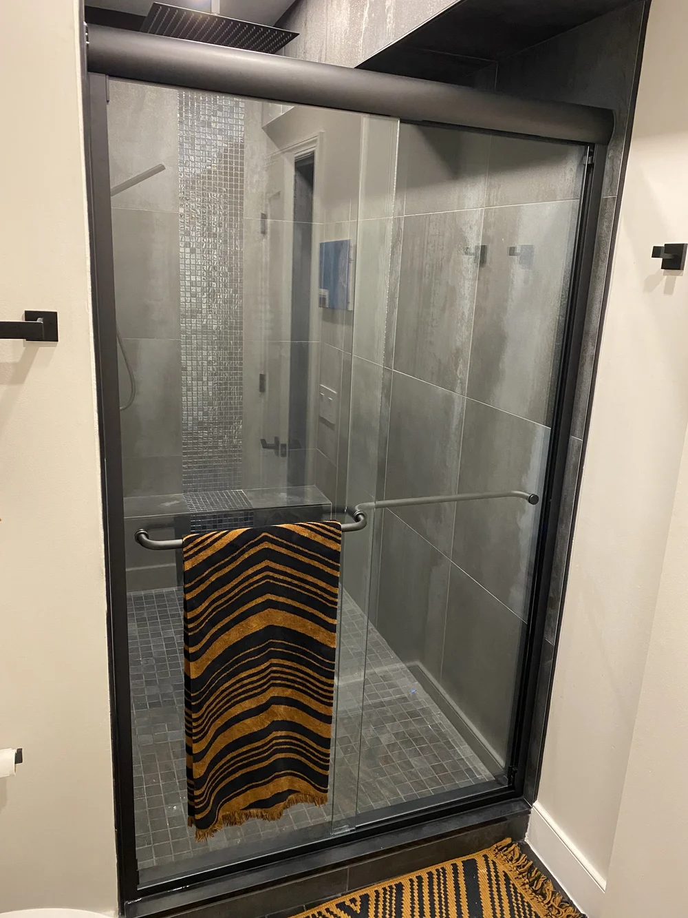 Semi-frameless sliding system in Oil-Rubbed Bronze
