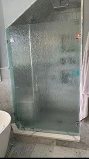 Shower door and panel with rain texture glass