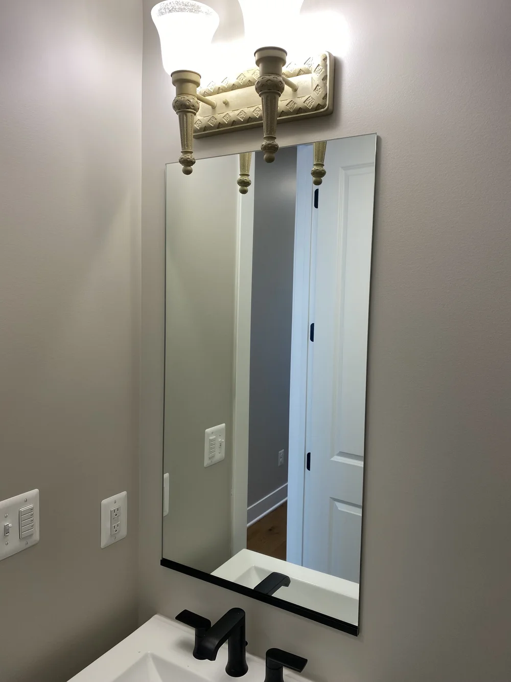 Bathroom mirror with Matte Black J-track