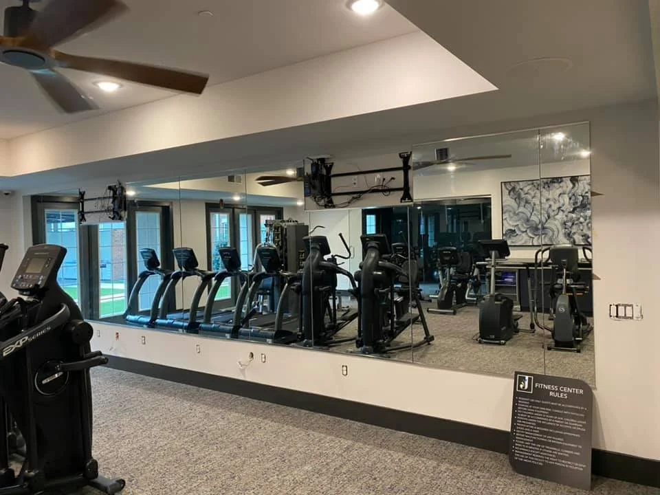 Fitness center mirror wall