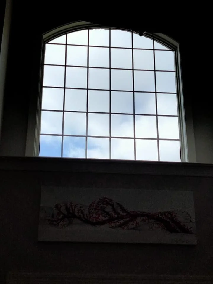 Large curved window with muntins