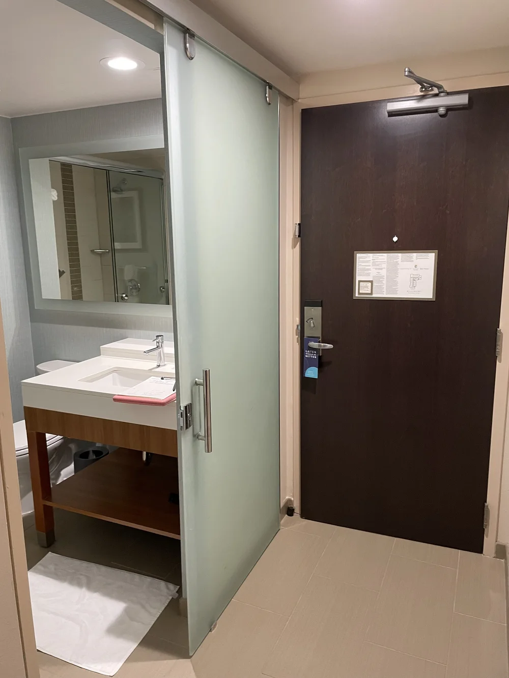 Sliding obscured glass door to bathroom