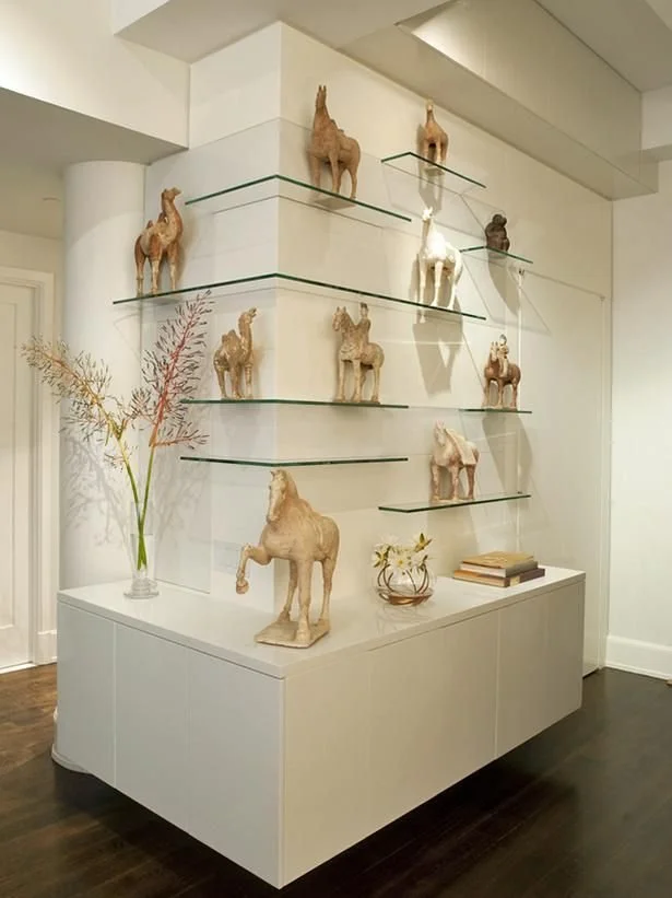 Glass shelves on the corner of a wall